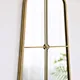gold arched mirror